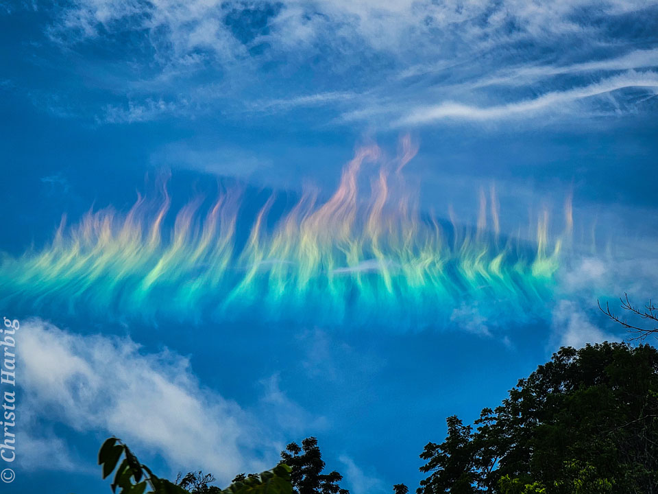 The picture shows a solar circumhorizontal arc -- nicknamed a fire rainbow
-- over West Virgina, USA. 
Please see the explanation for more detailed information.