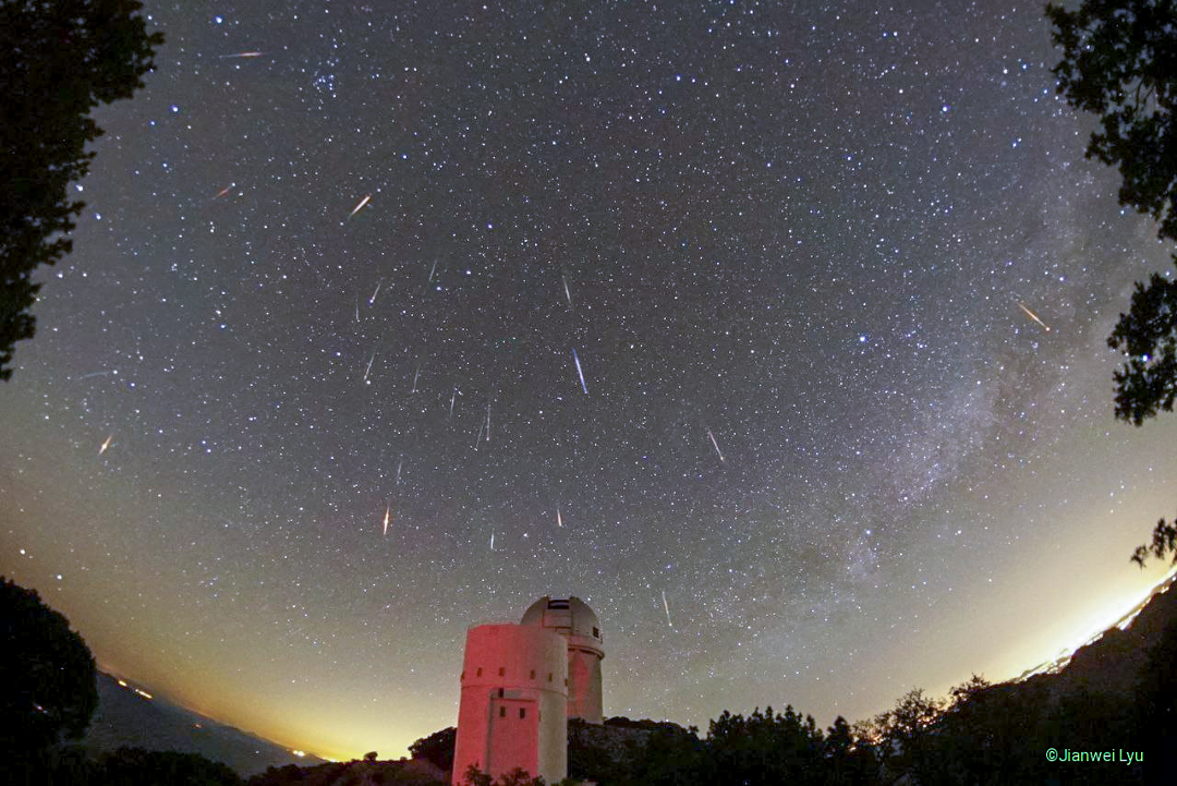 The featured image shows meteors from the usual docile
Tau Herculids meteor shower. The image records 19 images from the 
shower, with 3 other meteors also captured. In the foreground are
two telescopes from Kitt Peak: the 2.3-meter Bok telescope and the
4-meter Mayall telescope.
Please see the explanation for more detailed information.